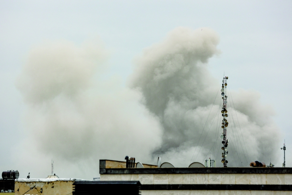 Smoke rises following a strike, amid the US-Israeli conflict with Iran, in Tehran. — Reuters 