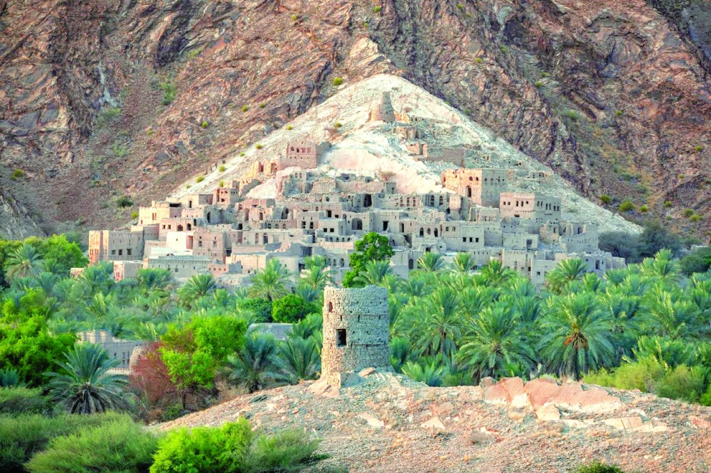 Al Hamra neighbourhood is built on a mountain slope overlooking an agricultural oasis.