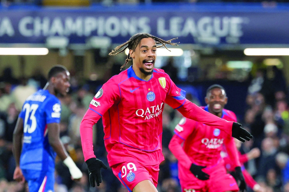 Paris Saint-Germain's French forward #29 Bradley Barcola celebrates after scoring his team second goal during the UEFA Champions League round of 16 second leg football match between Chelsea FC and Paris Saint-Germain (PSG) at Stamford Bridge, west London on March 17, 2026. (Photo by FRANCK FIFE / AFP)

