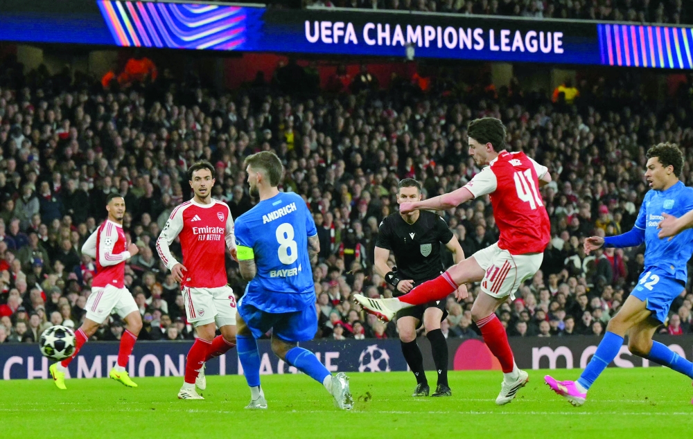 Arsenal's English midfielder #41 Declan Rice scores the team's second goal during the UEFA Champions League, last 16 second leg football match between Arsenal and Bayer Leverkusen at the Emirates Stadium in north London on March 17, 2026.  (Photo by Glyn KIRK / AFP)
