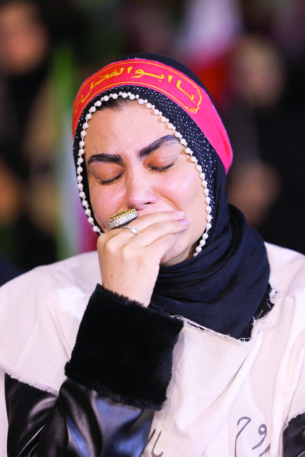 A woman cries during an anti-US and anti-Israel rally at Valiasr Square in Tehran, Iran, on Wednesday. - Reuters