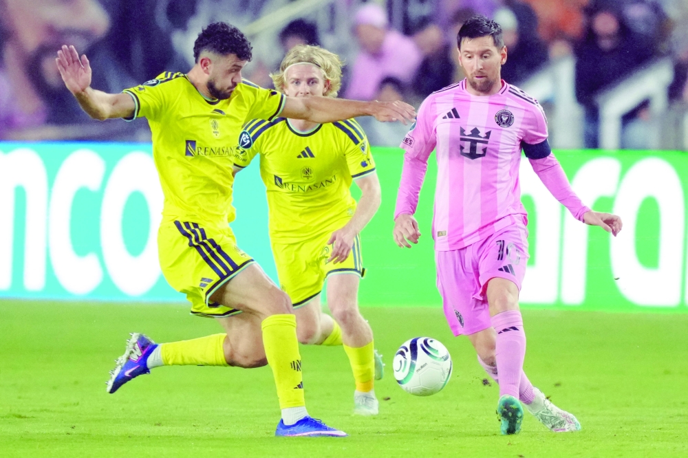 Inter Miami forward Lionel Messi (10) looks to pass the ball as Nashville SC midfielder Patrick Yazbek (8) closes in during the second half at Chase Stadium, Florida. — Imagn Images