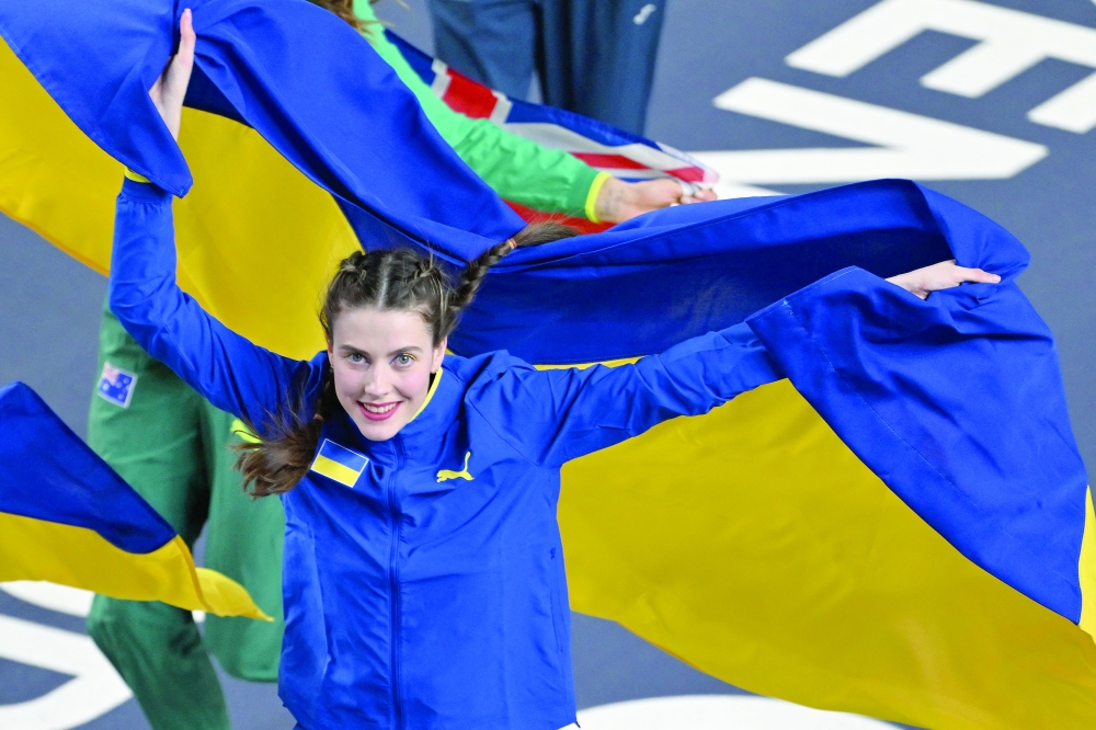 Ukraine's Yaroslava Mahuchikh celebrates winning gold in the women's final high jump event during the World Athletics Indoor Championships Kujawy Pomorze 2026 in Torun, Poland on March 20, 2026. (Photo by Andrej ISAKOVIC / AFP)

