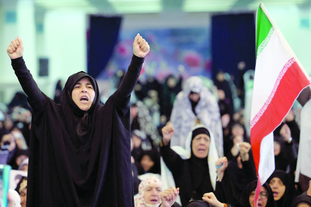 Iranian women during Eid Al Fitr prayers marking the end of Ramadhan at the Grand Mosalla mosque in Tehran. — AFP