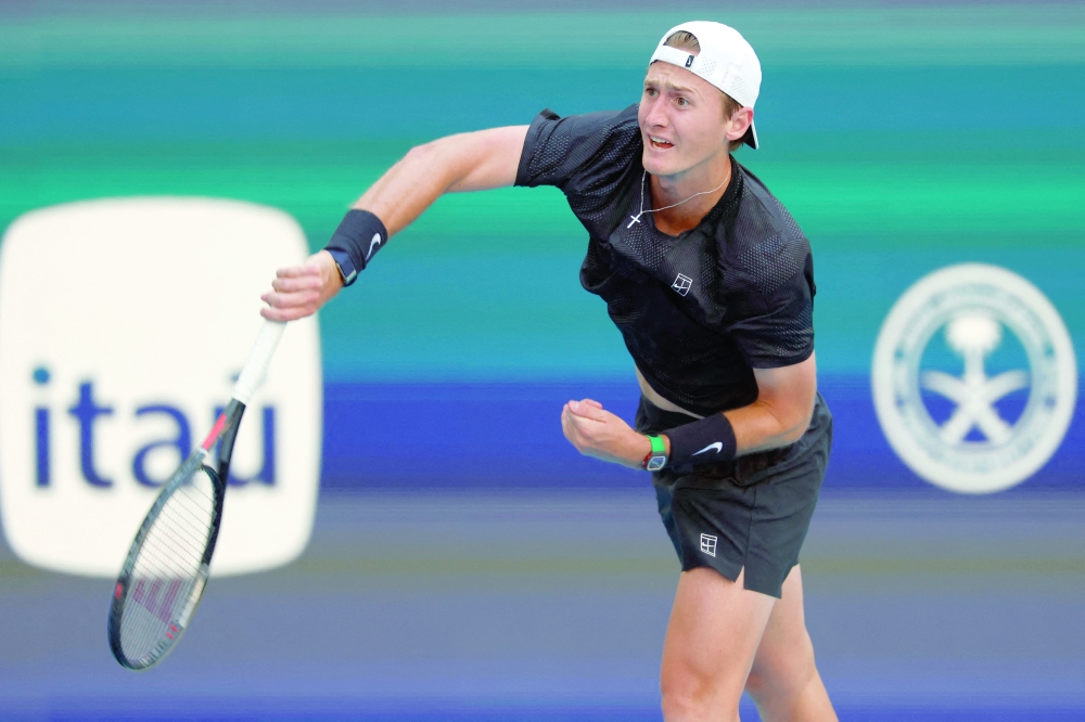 Sebastian Korda (USA) serves against Carlos Alcaraz (ESP) on day six of the 2026 Miami Open at Hard Rock Stadium. — Imagn Images