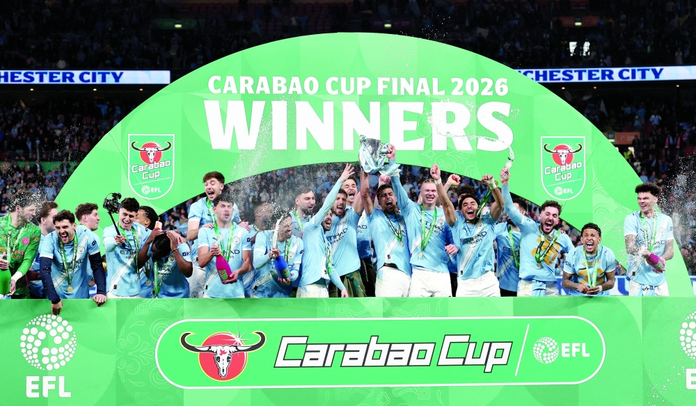 Manchester City players celebrate after winning the Carabao Cup. — Reuters