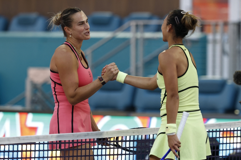  USA; Aryna Sabalenka (L) shakes hands with Qinwen Zheng (CHN) (R) at the net after their match 