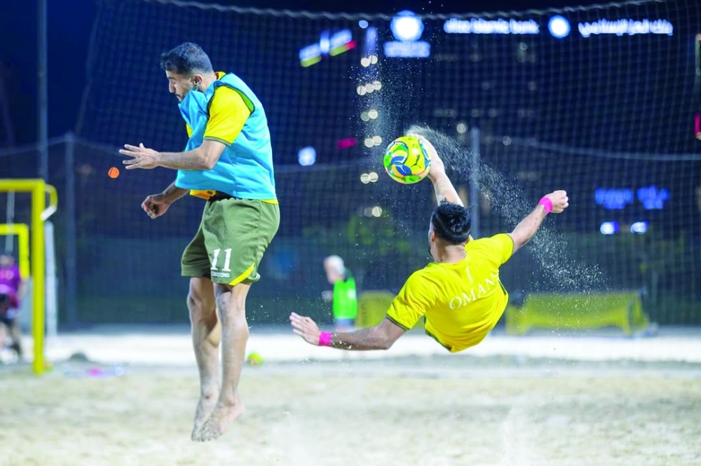 Oman players in action during a beach soccer training session in Bausher.