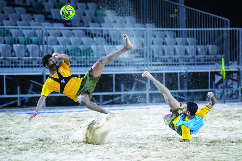 Oman players in action during a beach soccer training session in Bausher.