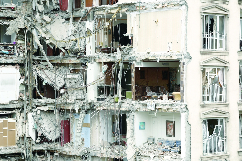 A view of a residential building damaged by a strike, in Tehran. — Reuters