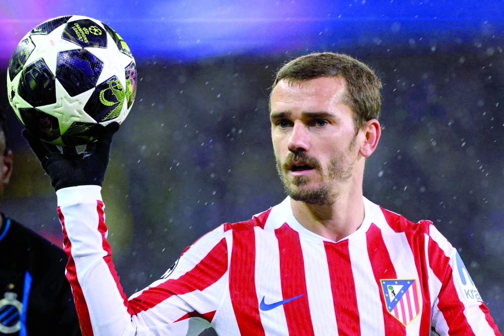 (FILES) Atletico Madrid's French forward #07 Antoine Griezmann holds the ball during the UEFA Champions League knockout round play-off first leg football match between Club Brugge and Atletico Madrid at the Jan Breydel Stadium in Brugge on February 18, 2026. Antoine Griezmann will leave Atletico Madrid for MLS side Orlando City at the end of the 2025-2026 season, the two clubs announced on March 24, 2026. (Photo by NICOLAS TUCAT / AFP)

