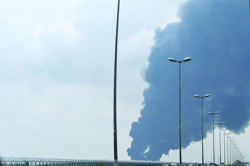 Smoke rises from the area of the Kuwait International Airport. — AFP