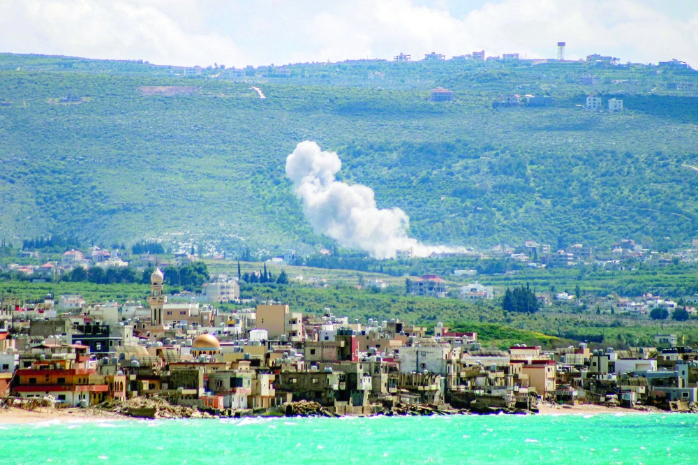 Smoke rises on the southern Lebanese village of Qlaileh. — AFP