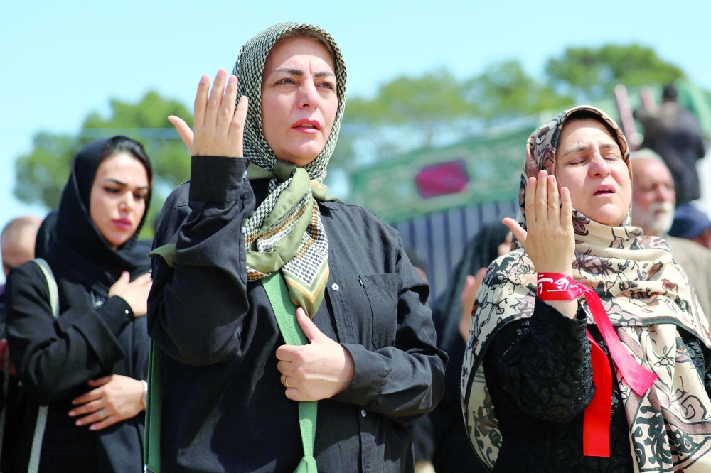 Iranian women mourn during a funeral for victims of the Middle East war at the Behesht Zahra cemetery in southern Tehran on Thursday. — AFP