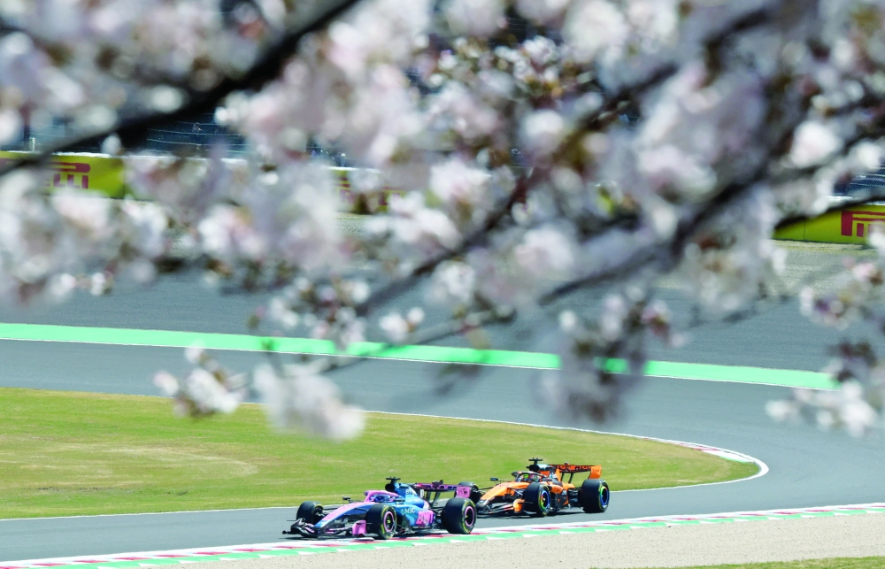 McLaren's Oscar Piastri and Alpine's Pierre Gasly in action during the first practice session at the Japanese Grand Prix in Suzuka. — Reuters