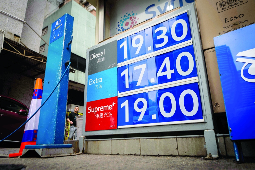 Gasoline prices are seen at a gas station in Macau. — AFP
