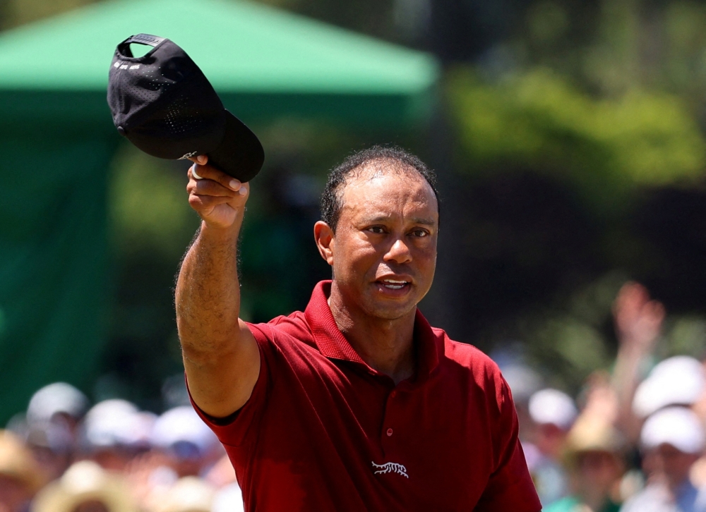  Tiger Woods of the U.S. acknowledges the crowd on the green on the 18th hole after completing his final round 