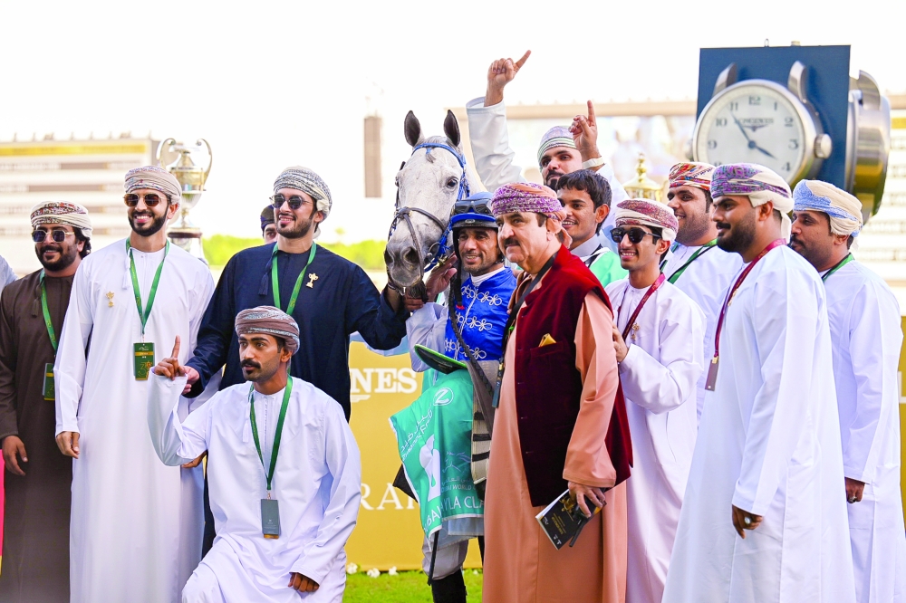 A group photo of the Sultanate Stud team celebrating their victory with the horse Falah. — Mohammed al Balushi
