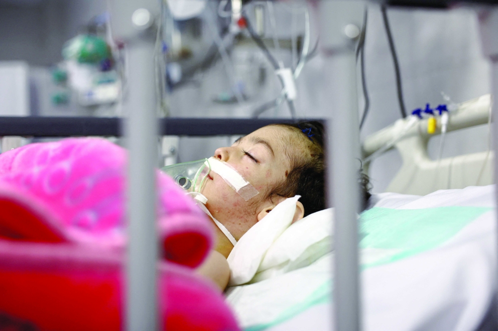 An Iranian child, Amir Hossein, is treated at Mofid Children's Hospital, in Tehran. — Reuters