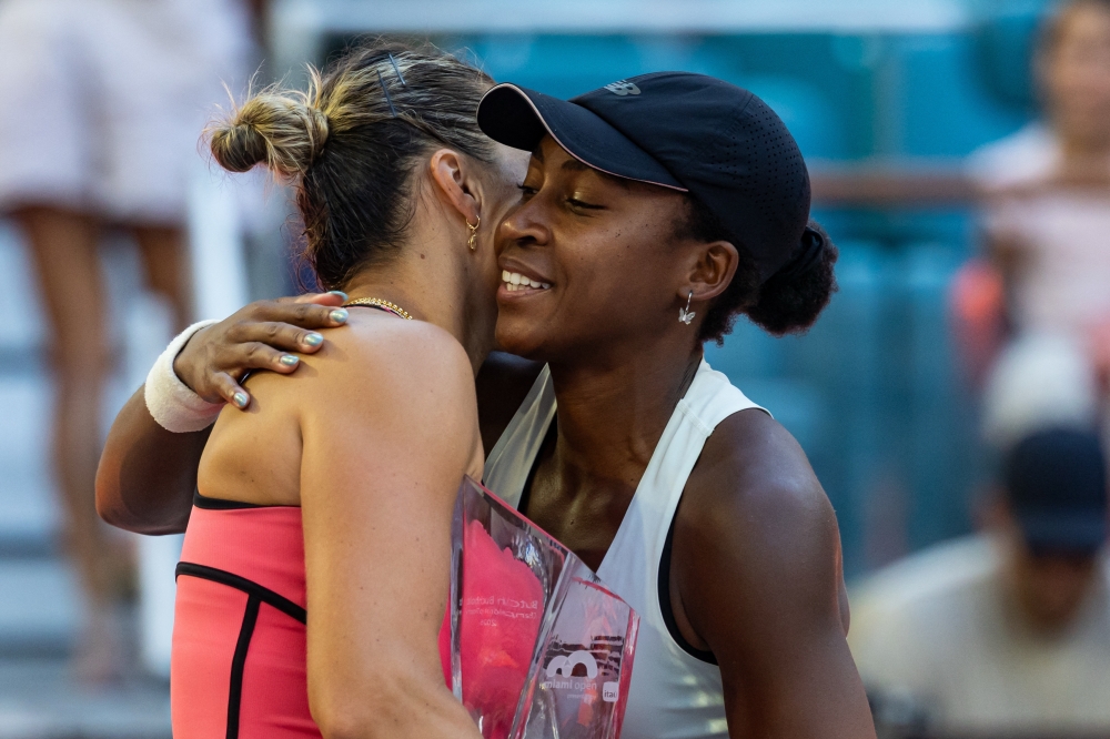 Aryna Sabalenka of Belarus embraces Coco Gauff of the United States after defeating her in the final