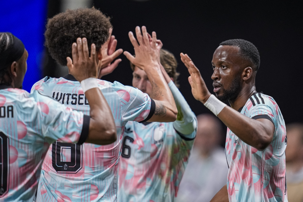Belgium’s Dodi Lukebakio (right) react with teammates after scoring his second goal against the USA 