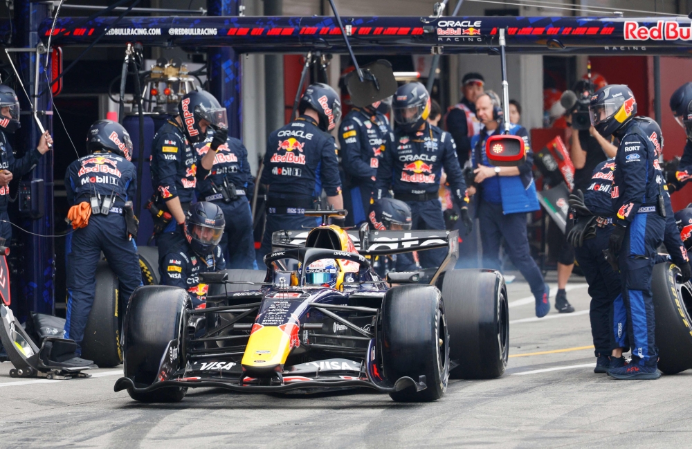 Red Bull Racing's Dutch driver Max Verstappen leaves after a pit stop during the Formula One Japanese Grand Prix  