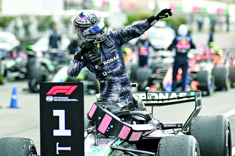 Mercedes' Italian driver Kimi Antonelli celebrates at the parc ferme after winning the Formula One Japanese Grand Prix at the Suzuka circuit in Suzuka, Mie prefecture on March 29, 2026.  (Photo by Philip FONG / AFP)
