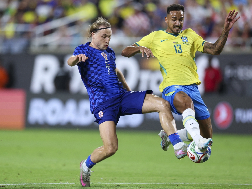 Croatia midfielder Lovro Majer (7) scores a goal past Brazil defender Danilo (13) in the second half  