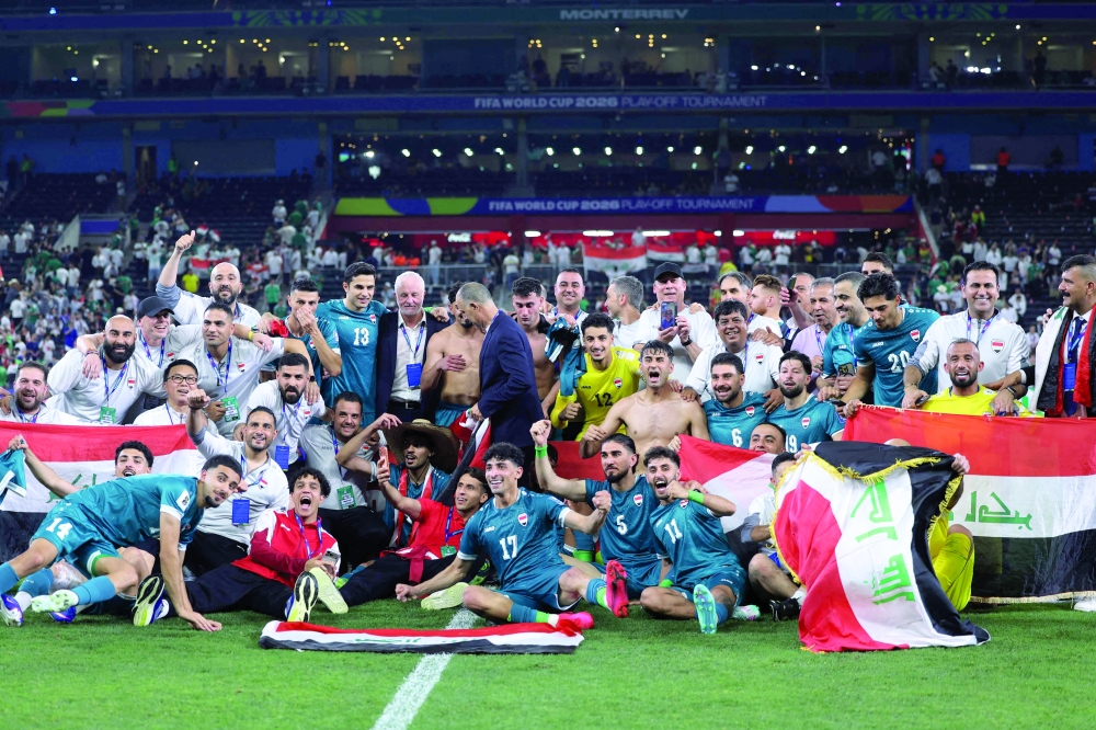 Iraq's players celebrate after winning the 2026 FIFA World Cup qualifiers final playoff football match between Iraq and Bolivia at the BBVA Stadium in Guadalupe, Nuevo Leon state, Mexico, on March 31, 2026.  (Photo by Julio Cesar AGUILAR / AFP)
