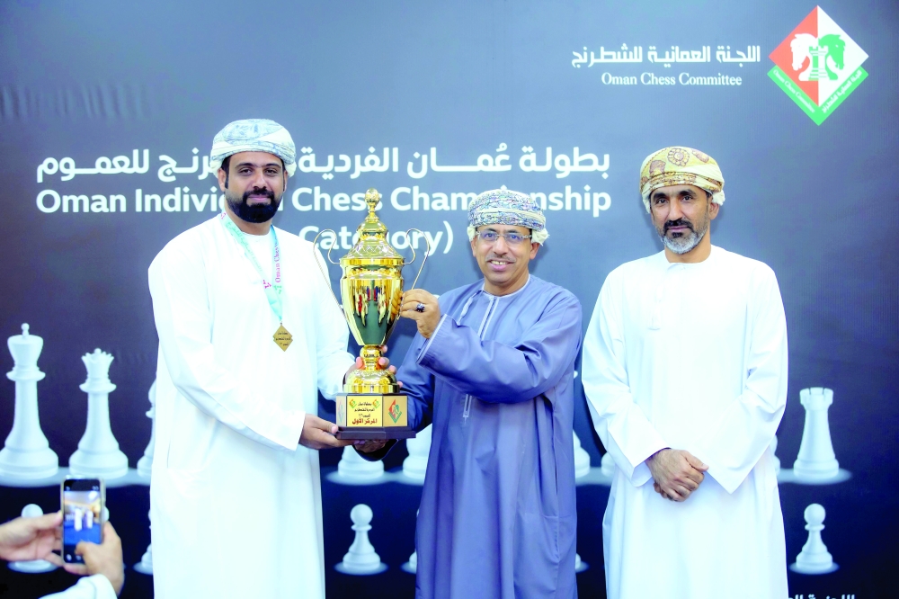 Mohammed bin Khalfan al Saidi of Nakhal Club receives the winner's trophy. — Salem al Salhi