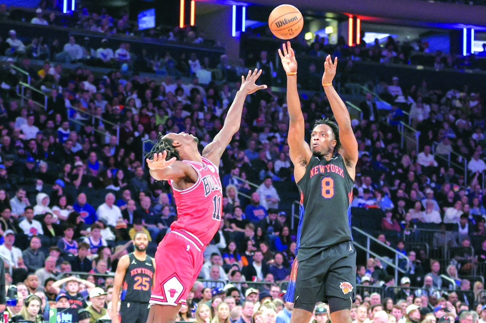 New York Knicks forward Og Anunoby takes a three-point shot past Chicago Bulls forward Leonard Miller. — Imagn Images