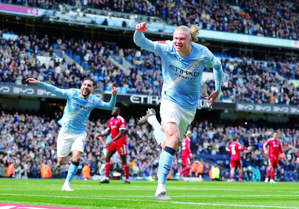 Manchester City's Erling Haaland celebrates scoring their first goal. — Reuters