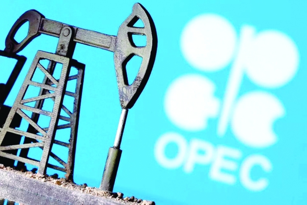 A model of an oil pump is seen in front of the OPEC logo in this illustration. — Reuters
