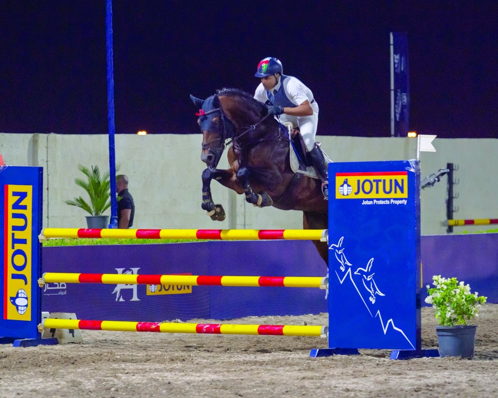 A shot of a competitor jumping over the 120cm barrier. — Ayman al Harrasi