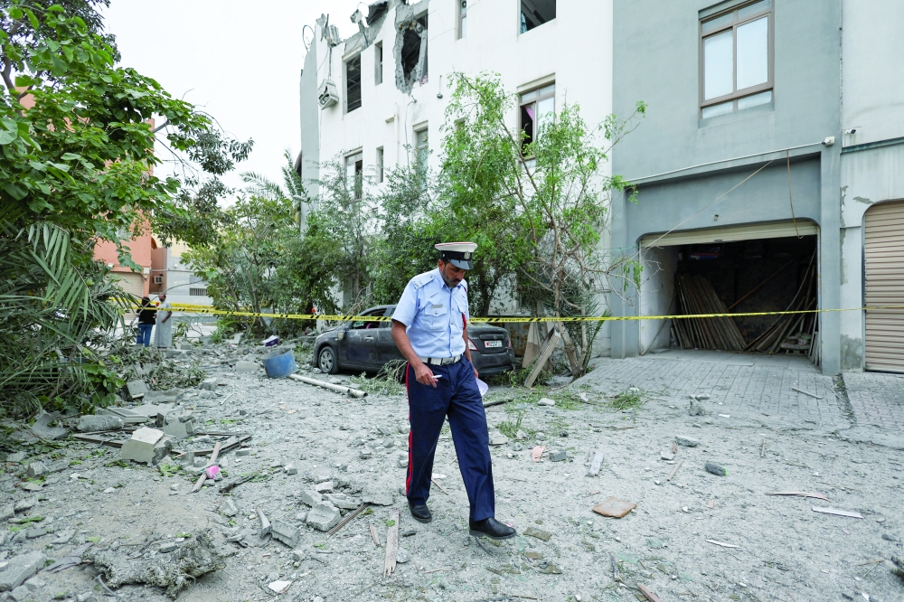 Aftermath of the impact of falling debris from an intercepted Iranian drone in Sitra, Bahrain. — Reuters 