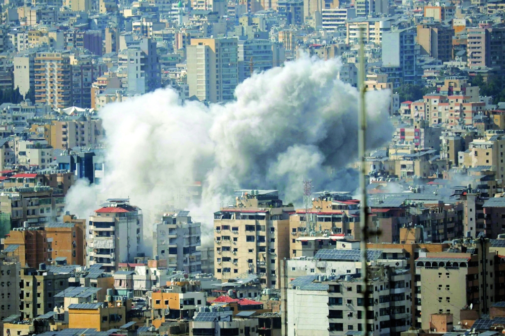 Smoke rises from the site of an Israeli strike in Beirut's southern suburbs. — AFP