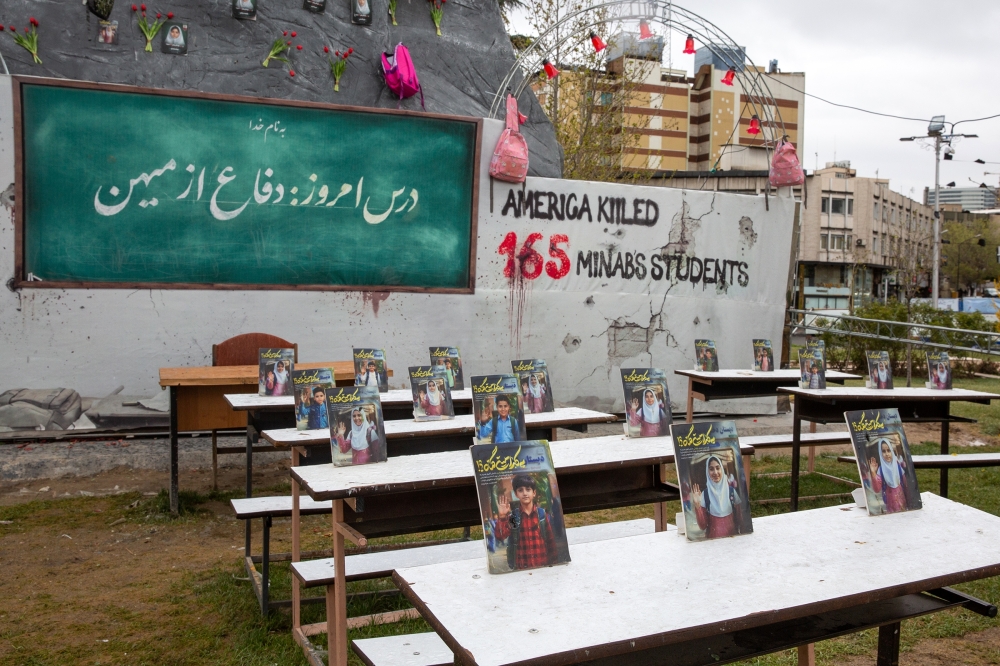 A classroom with photos of the victims of Minab school that was targeted by US missiles is added to Vanak Square in Tehran, Iran, on February 28, 2026