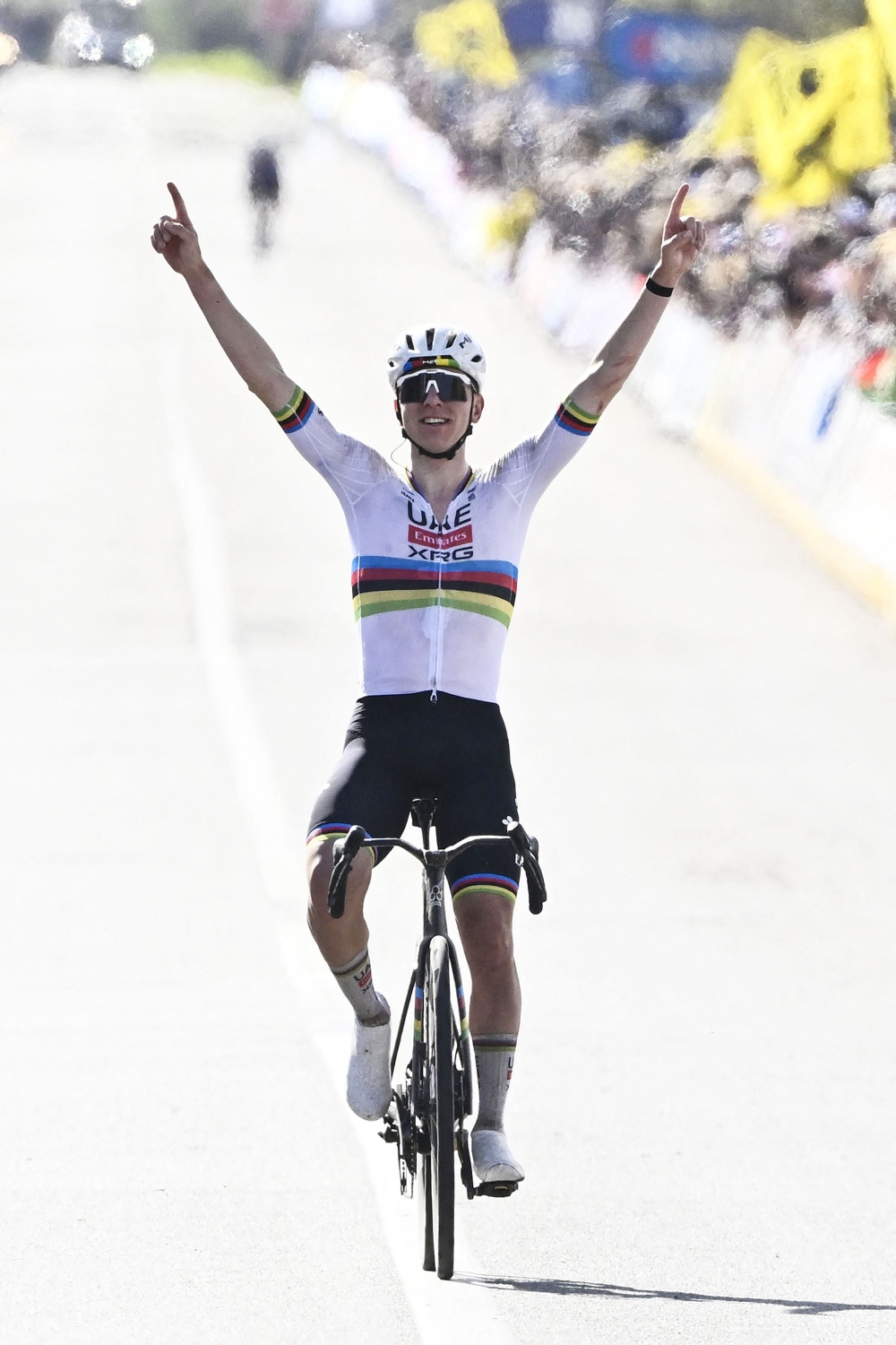UAE Team Emirates  Slovenian rider Tadej Pogacar celebrates as he crosses the finish line 