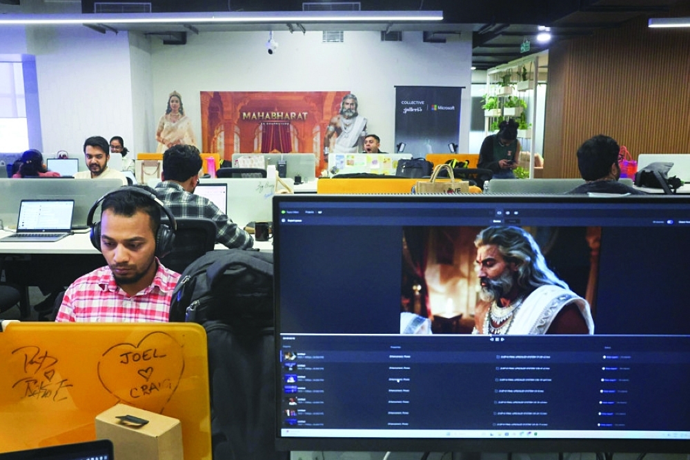 Employees at work at Galleri5, the tech studio arm of Bollywood talent agency Collective Artists Network. AI is enabling studios in India to slash production timelines and costs, industry figures say. — Reuters
