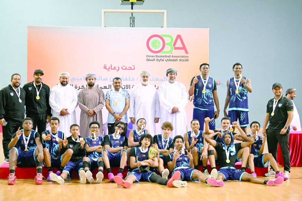 Salalah players celebrate with the trophy. — Khalfan al Ruzaiqi