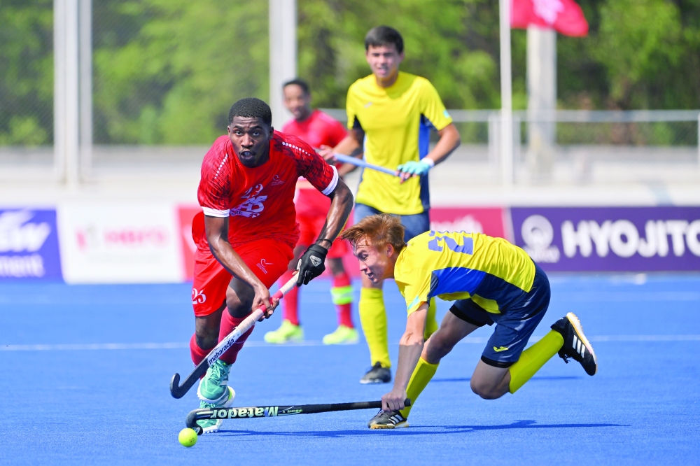 Oman and Kazakhstan players in action.