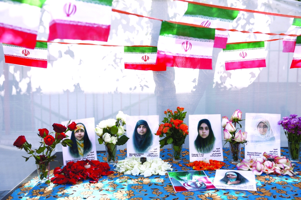Pictures of the Minab School students are displayed during a ceremony, in Tehran. — Reuters 