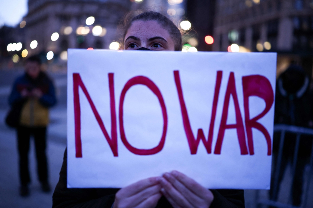 A demonstrator holds a sign during a protest in the Manhattan borough of New York City