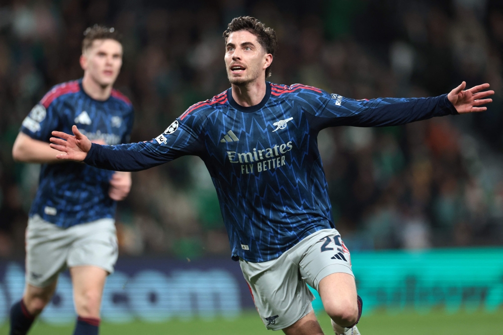 Arsenal's German midfielder #29 Kai Havertz celebrates after scoring during the UEFA Champions League quarter final first leg football match between Sporting CP and Arsenal  