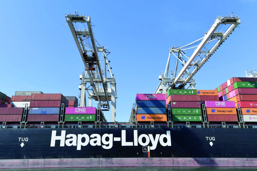(FILES) A Hapag Lloyd container ship is seen in Rotterdam's harbour on August 1, 2022. German shipping giant Hapag-Lloyd's vessels will not resume transiting the Strait of Hormuz for now as the situation remains "tense" despite a ceasefire between the United States and Iran, German media reported on April 8, 2026. (Photo by JOHN THYS / AFP)
