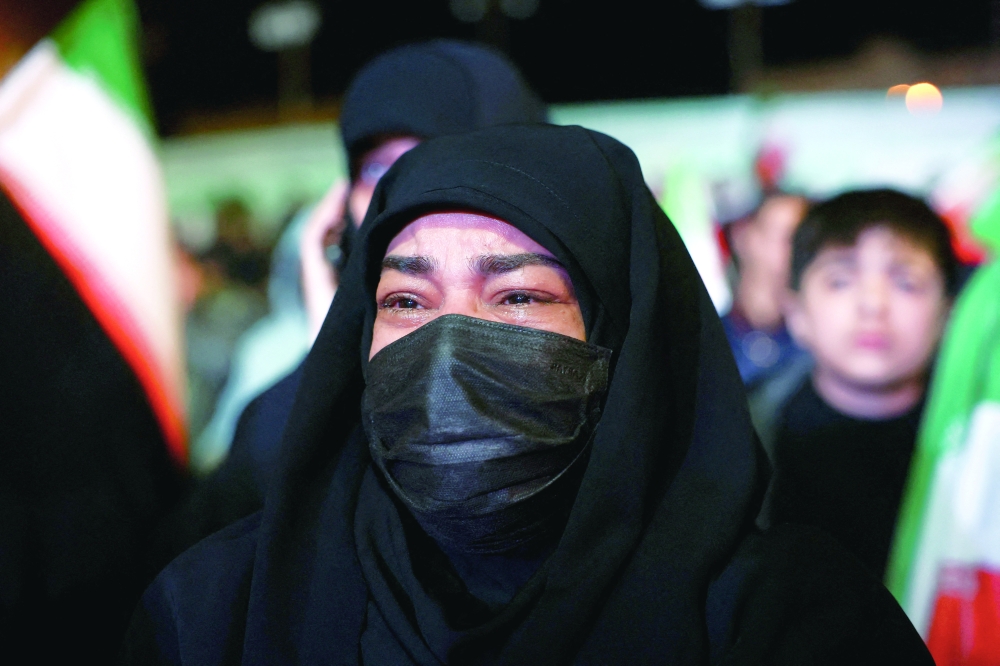 People gather after a two-week ceasefire in the Iran war was announced, in Tehran. — Reuters