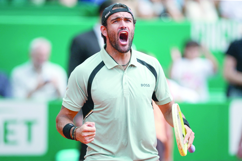 Italy's Matteo Berrettini celebrates after winning against Russia's Daniil Medvedev during the Monte Carlo ATP Masters Series Tournament round of 32 tennis match on Court Rainier III at the Monte-Carlo Country Club in Roquebrune-Cap-Martin, south-eastern France on April 8, 2026. (Photo by Valery HACHE / AFP)
