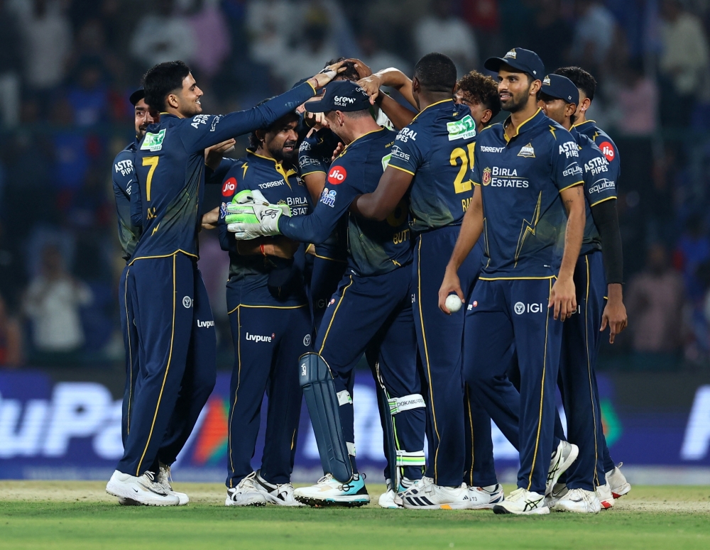 Gujarat Titans players celebrate after the match 