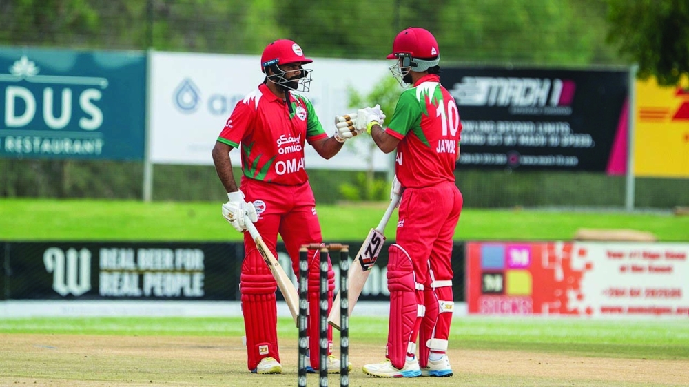 Oman skipper Jatinder Singh and Ashish Odedara during their 100-run opening wicket partnership against Scotland.