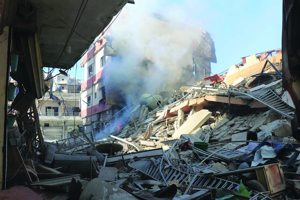 Smoke billows from the site of an Israeli air strike the day before that targeted a neighbourhood in the southern Lebanese coastal city of Tyre. — AFP
